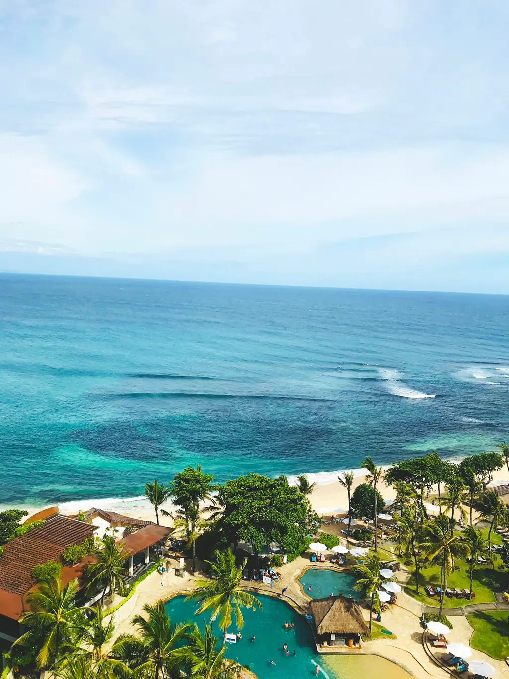 The resort gardens and the turquoise house reef seen from above